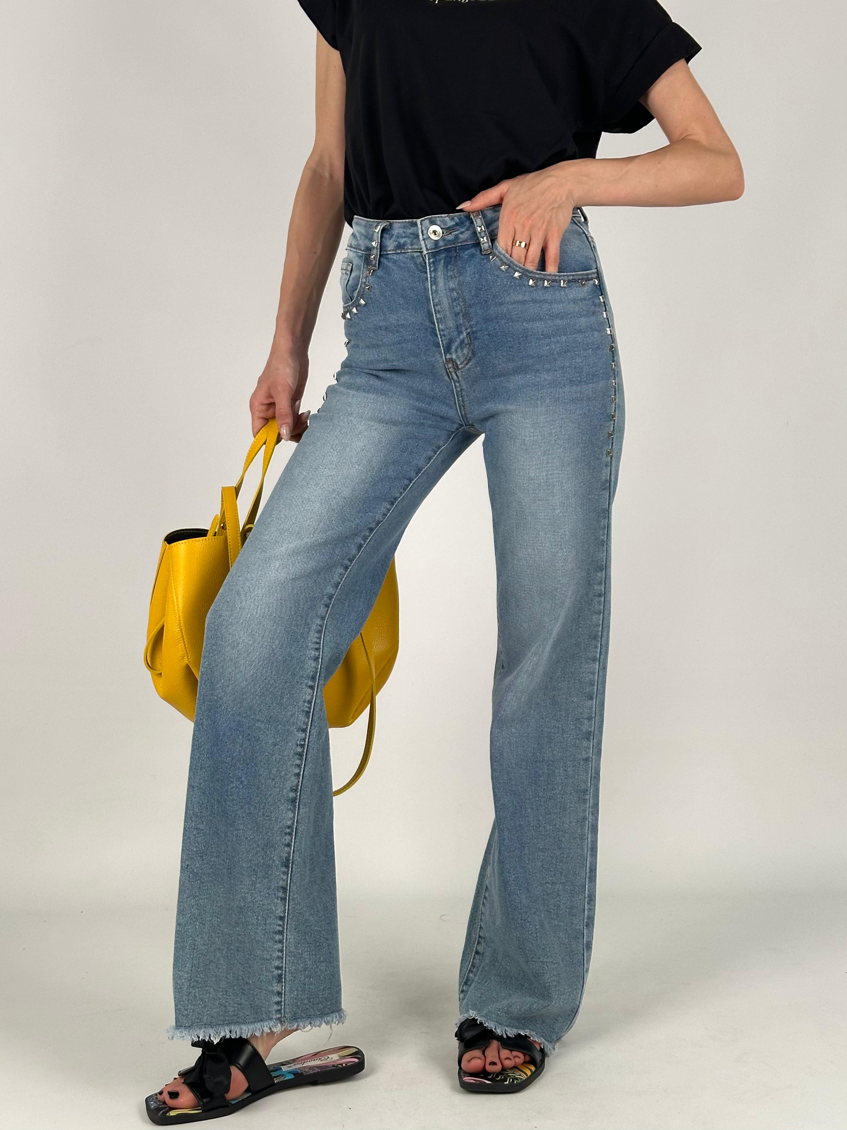 Jeans tasca borchiata