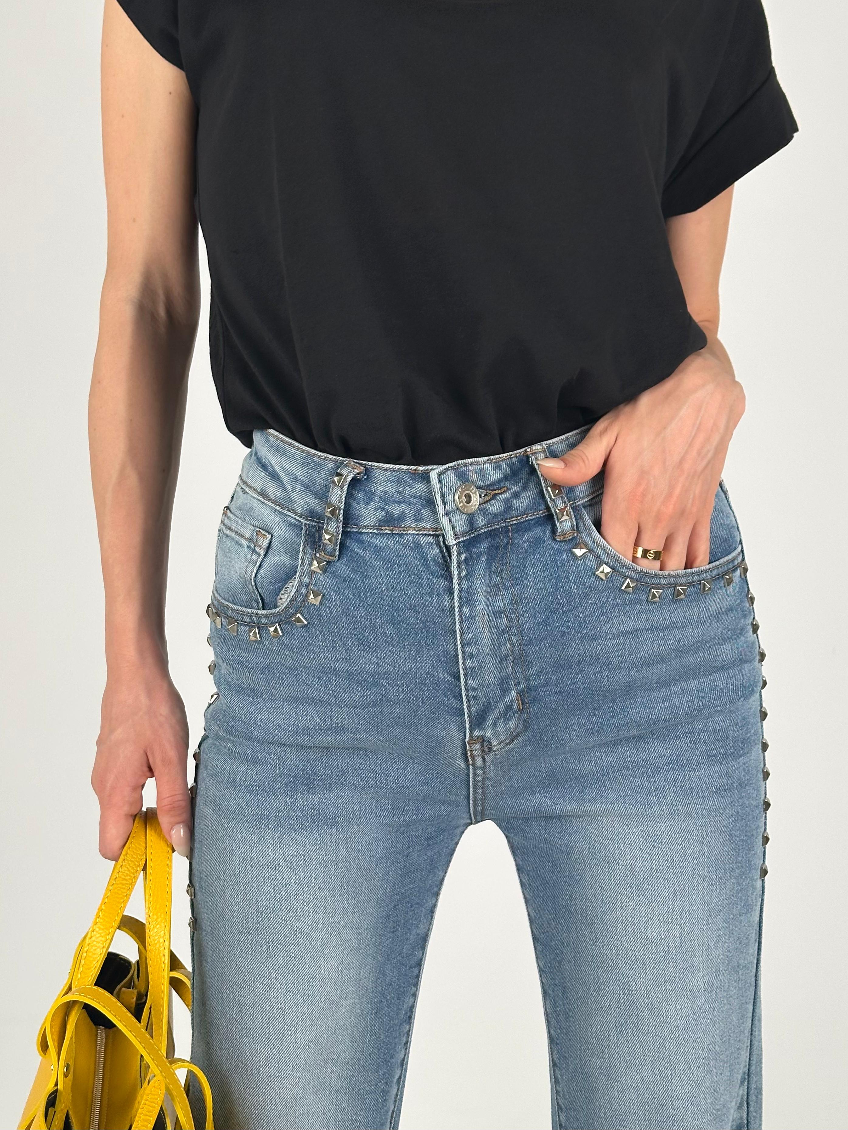 Jeans tasca borchiata