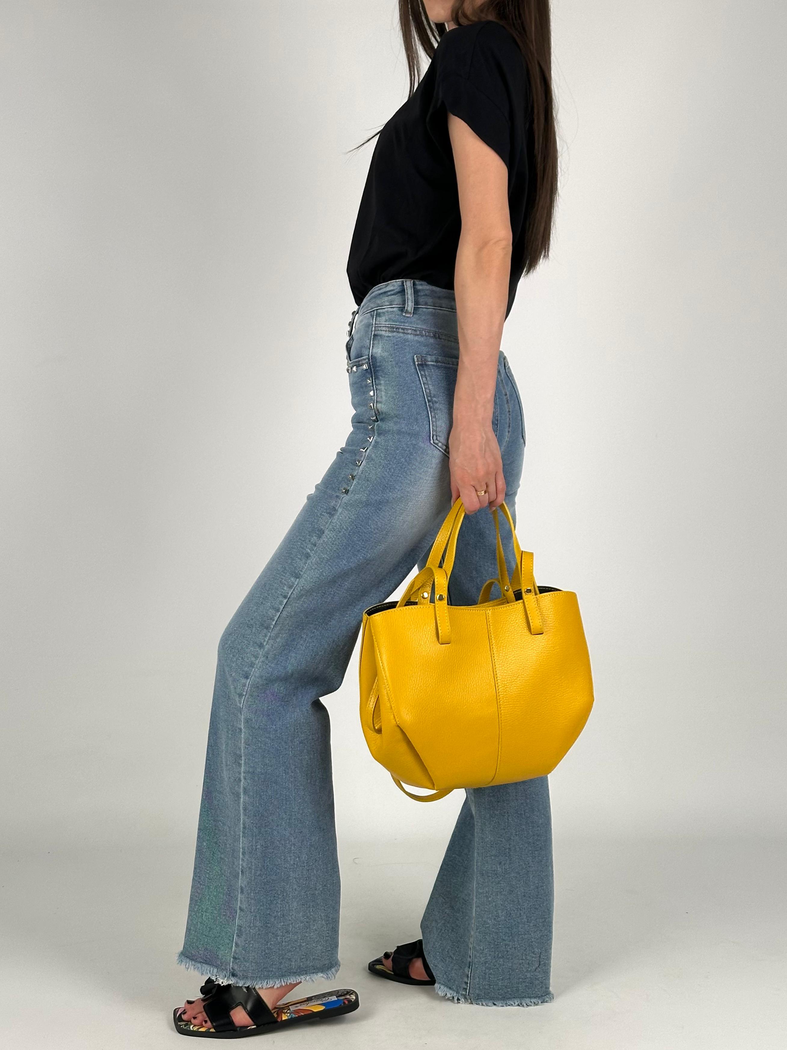 Jeans tasca borchiata