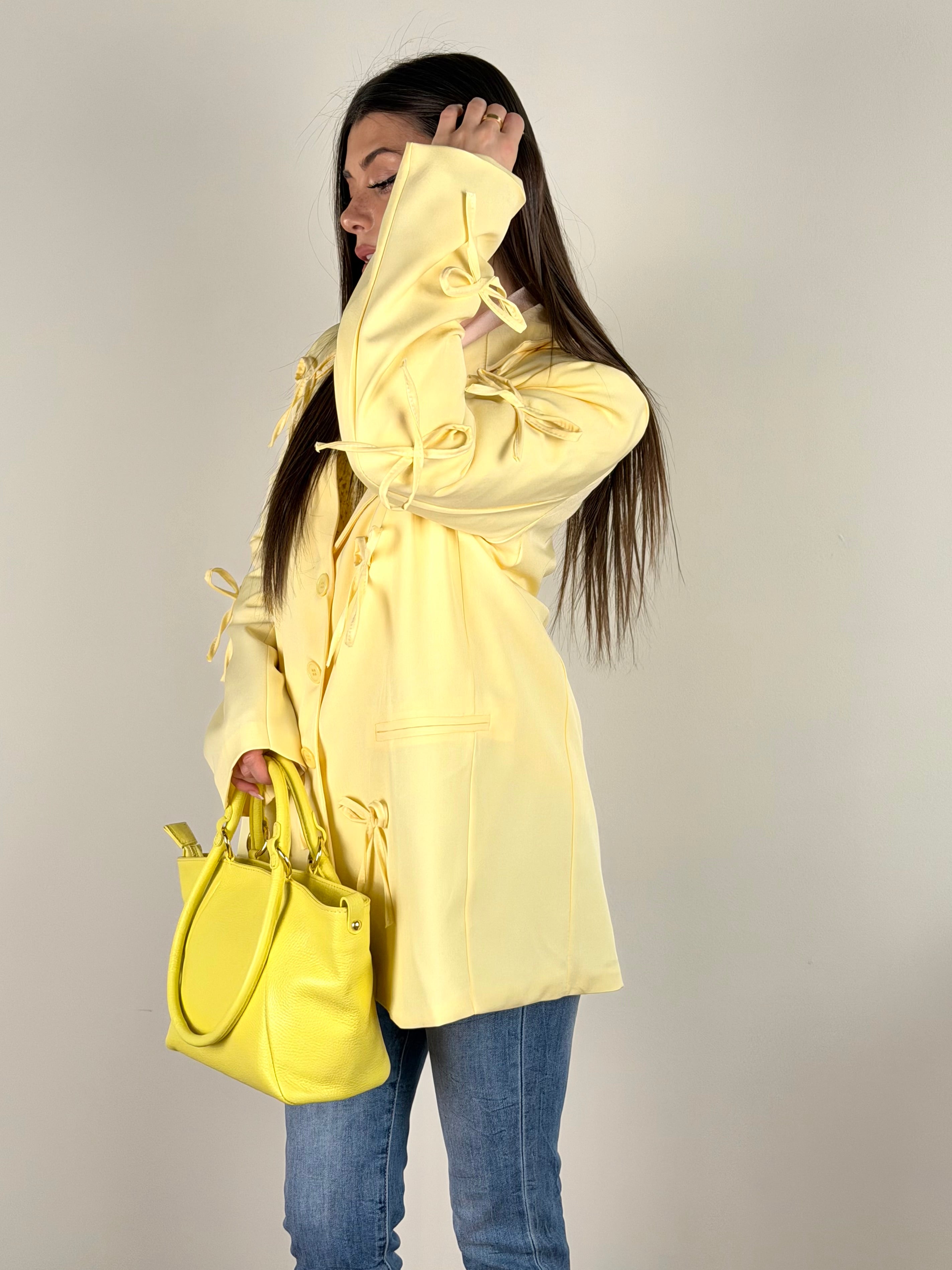 Giacca fiocchi gialla